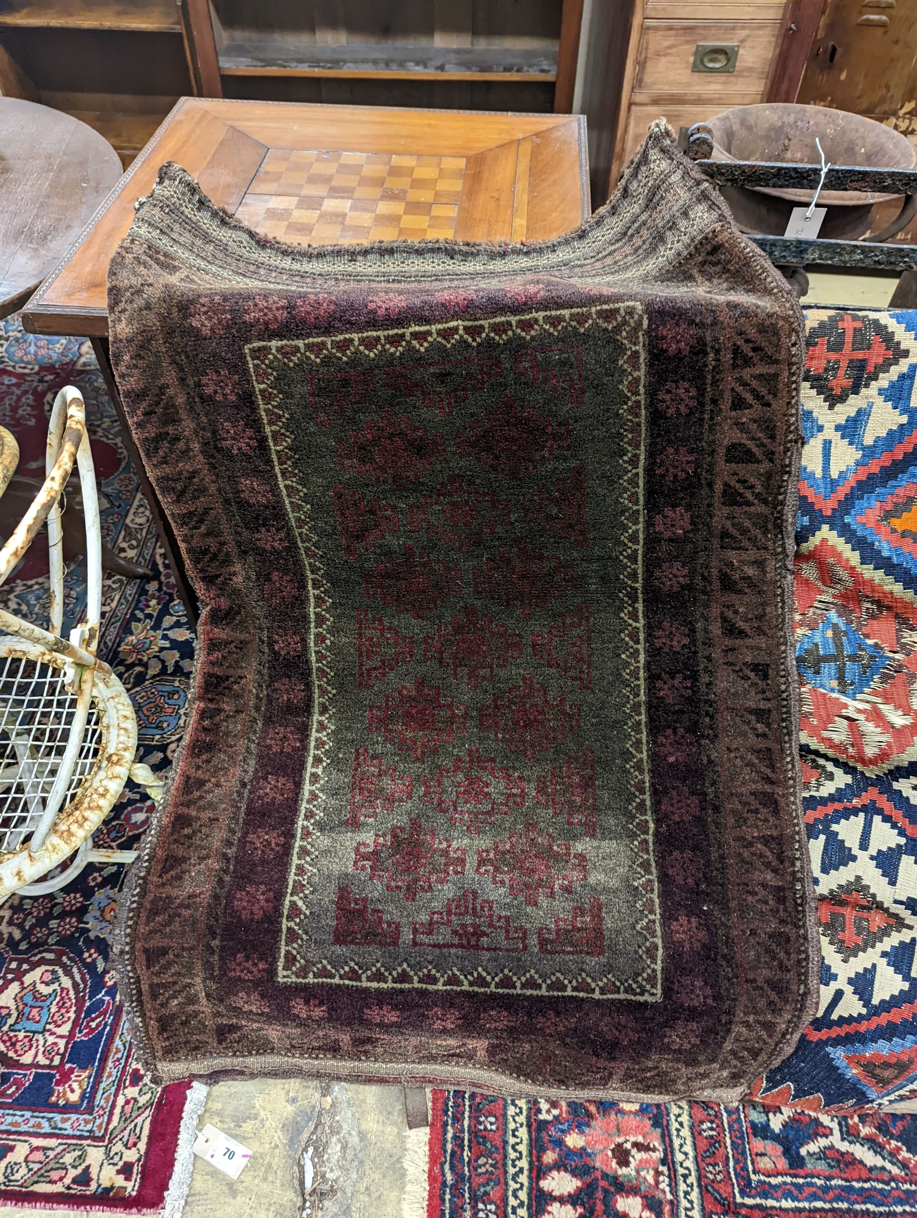 A Kelim flatweave rug, an Indian fabric panel and a saddle bag